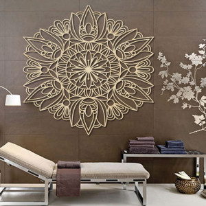 Carved flower mandala wooden picture on a plywood wall