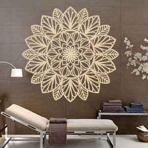 Carved flower mandala wooden picture on a plywood wall