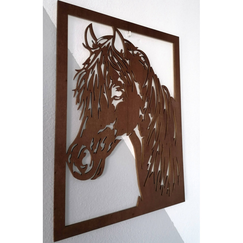 Carved painting on a wall of a wooden plywood head horse